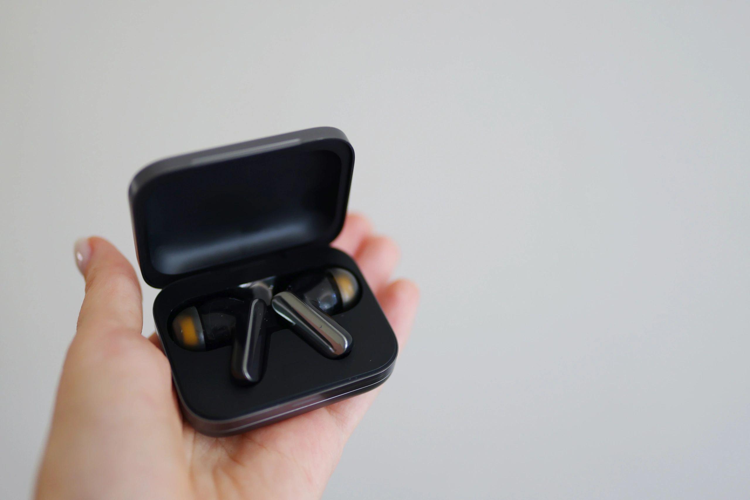 Wireless earbuds in charging case
